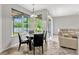Breakfast nook featuring a round table, four chairs, and large windows at 2681 Cabernet Cir, Ocoee, FL 34761