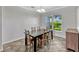 Bright dining room with a large window and a stylish chandelier at 2681 Cabernet Cir, Ocoee, FL 34761