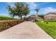 Charming single-story home features a paved driveway and well-manicured lawn at 2681 Cabernet Cir, Ocoee, FL 34761