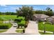 Home exterior with a landscaped front yard, long driveway, and a green lawn in a suburban setting at 2681 Cabernet Cir, Ocoee, FL 34761