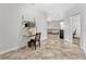 Hallway with tile floors, decorated shelves, and views into the living room at 2681 Cabernet Cir, Ocoee, FL 34761