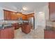 Gourmet kitchen featuring stainless steel appliances and dark granite countertops at 2681 Cabernet Cir, Ocoee, FL 34761