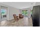 Living room featuring tile flooring, comfortable seating, and access to the outdoors at 2681 Cabernet Cir, Ocoee, FL 34761