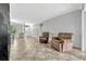 Neutral living room boasts tile flooring and comfortable seating at 2681 Cabernet Cir, Ocoee, FL 34761