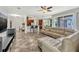 Living room area with open floor plan, tile floors, and view into the kitchen at 2681 Cabernet Cir, Ocoee, FL 34761