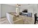 Bright living room featuring neutral color palette, tile floors, and a comfortable sectional sofa at 2681 Cabernet Cir, Ocoee, FL 34761