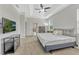 Main bedroom with carpeted floors, tray ceiling, a television, and neutral color palette at 2681 Cabernet Cir, Ocoee, FL 34761