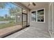 Spacious screened patio offers serene outdoor views of a playground and backyard at 2681 Cabernet Cir, Ocoee, FL 34761