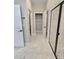 Bathroom featuring a walk-in shower with black trim, and a view of the closet at 2699 Sw 161St Loop, Ocala, FL 34473