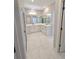 Bright bathroom featuring dual vanities, sleek hardware and a large vanity mirror at 2699 Sw 161St Loop, Ocala, FL 34473