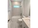 Bathroom featuring a bathtub with gray tile and a white vanity and countertop at 2699 Sw 161St Loop, Ocala, FL 34473