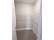 Walk-in closet with installed white wire shelving and gray carpet flooring at 2699 Sw 161St Loop, Ocala, FL 34473