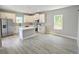 Spacious kitchen featuring white cabinets, a center island, and modern stainless steel appliances at 2699 Sw 161St Loop, Ocala, FL 34473