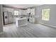 Well-equipped kitchen with white cabinetry, stainless steel appliances, and a kitchen island at 2699 Sw 161St Loop, Ocala, FL 34473
