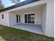Covered patio includes sliding glass doors, a back door, and a view of the backyard at 2699 Sw 161St Loop, Ocala, FL 34473
