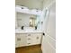 Modern bathroom featuring double sinks, sleek fixtures, and a large mirror at 319 Anchovie Ct, Poinciana, FL 34759