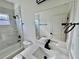 Bathroom features marble-look tile and black fixtures including faucet and shower head at 319 Anchovie Ct, Poinciana, FL 34759