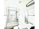 Bathroom featuring a shower-tub combo and modern fixtures at 319 Anchovie Ct, Poinciana, FL 34759