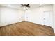 Spacious bedroom featuring hardwood floors, neutral walls and ceiling fan at 319 Anchovie Ct, Poinciana, FL 34759