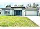 Charming single-story home with a well-manicured lawn at 319 Anchovie Ct, Poinciana, FL 34759