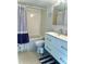 Bathroom featuring a shower-tub combination, white vanity with drawers, and tiled flooring at 3207 Westridge Blvd # 104, Orlando, FL 32822
