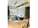 Bright kitchen featuring sleek countertops and modern fixtures with a view to outside at 3207 Westridge Blvd # 104, Orlando, FL 32822