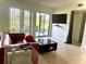 Contemporary living room with a sleek black coffee table and access to a patio at 3207 Westridge Blvd # 104, Orlando, FL 32822