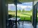 Covered patio area with seating, perfect for enjoying the serene green surroundings at 3207 Westridge Blvd # 104, Orlando, FL 32822