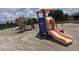 Community playground with colorful slides and climbing structures, perfect for outdoor fun at 3207 Westridge Blvd # 104, Orlando, FL 32822