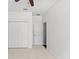 Spacious bedroom with carpet, closet, ceiling fan, and white trim at 3426 Schoolhouse Rd, Harmony, FL 34773