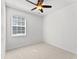 A bedroom with carpet floors, a ceiling fan, and a window with blinds at 3426 Schoolhouse Rd, Harmony, FL 34773