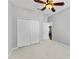 A bedroom featuring a fan and a closet at 3426 Schoolhouse Rd, Harmony, FL 34773