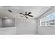 Open bonus room with ceiling fan and carpet floors with window views at 3426 Schoolhouse Rd, Harmony, FL 34773