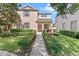 Charming two-story home featuring well-manicured landscaping and a welcoming front entrance at 3426 Schoolhouse Rd, Harmony, FL 34773