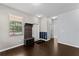 The home's foyer offers dark wood floors and a convenient coat rack and shoe storage area at 3426 Schoolhouse Rd, Harmony, FL 34773