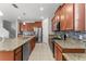 Well-equipped kitchen features granite countertops, stainless steel appliances, and ample counter space at 3426 Schoolhouse Rd, Harmony, FL 34773