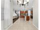 Open floor plan with a spacious kitchen featuring stainless steel appliances and a central island at 3426 Schoolhouse Rd, Harmony, FL 34773
