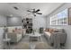 Bright living room with modern decor, comfortable seating, and contemporary shelving at 3426 Schoolhouse Rd, Harmony, FL 34773