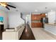 Open-concept living room seamlessly connects to the kitchen, creating a spacious and inviting atmosphere at 3426 Schoolhouse Rd, Harmony, FL 34773