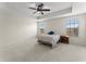 Bedroom featuring carpeted floors, ceiling fan and great windows at 3426 Schoolhouse Rd, Harmony, FL 34773