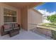 Enclosed patio featuring cushioned seating and an open view to the backyard at 3426 Schoolhouse Rd, Harmony, FL 34773