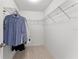 Bright walk-in closet featuring wire shelving and ample storage space for clothing and accessories at 3426 Schoolhouse Rd, Harmony, FL 34773