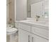 Bright bathroom with vanity, quartz countertops, tile backsplash and white cabinets at 3678 Rollin O Ln, Apopka, FL 32703