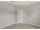 Bedroom features neutral carpet, door, and base trim around the perimeter of the room at 3678 Rollin O Ln, Apopka, FL 32703