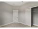 Bedroom features neutral carpet, base trim, a door, and a closet with folding doors at 3678 Rollin O Ln, Apopka, FL 32703