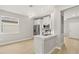 Modern kitchen featuring stainless steel appliances, quartz countertops, and ample cabinet space at 3678 Rollin O Ln, Apopka, FL 32703
