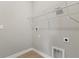 Practical laundry room with vinyl flooring and wire shelving for storage solutions at 3678 Rollin O Ln, Apopka, FL 32703