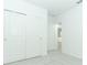 Bright bedroom featuring carpet and white doors that provide ample storage space at 471 Wayland Dr, Haines City, FL 33844