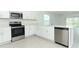 Bright kitchen with stainless steel appliances and quartz countertops at 471 Wayland Dr, Haines City, FL 33844