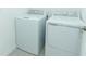 New white front load washer and dryer in the laundry room at 471 Wayland Dr, Haines City, FL 33844